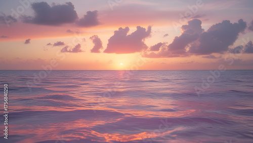 Sunset over the sea and ocean with colorful sky and clouds