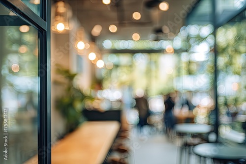 Wallpaper Mural Interior view of a cafe with warm lighting, blurry background, and visible window framing Torontodigital.ca