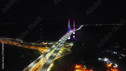 Illuminated Heroes of Chaco Bridge At Night In Paraguay, South America. Aerial Drone Shot