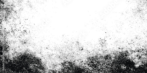 Grunge black and white distressed texture with scattered speckles and blotches for abstract background or overlay design.