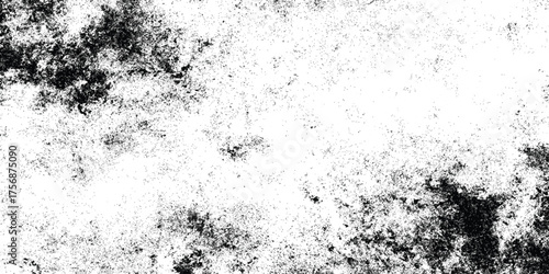 Grunge black and white distressed texture with scattered speckles and blotches for abstract background or overlay design.