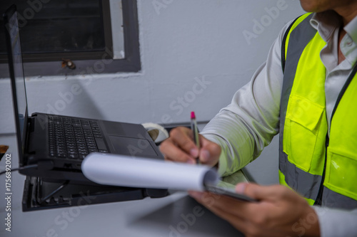 Quadro su tela A skilled engineer is seriously planning a warehouse expansion for a large manufacturing plant