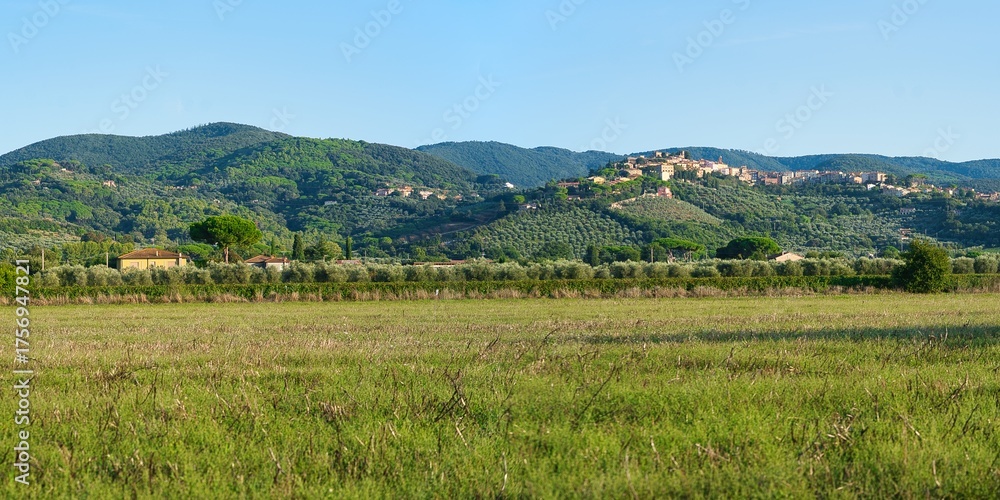Fototapeta premium Panorama of Castagneto Carducci, a picturesque village in Tuscany with narrow streets, squares, and panoramic views of the countryside and the Tyrrhenian Sea.
