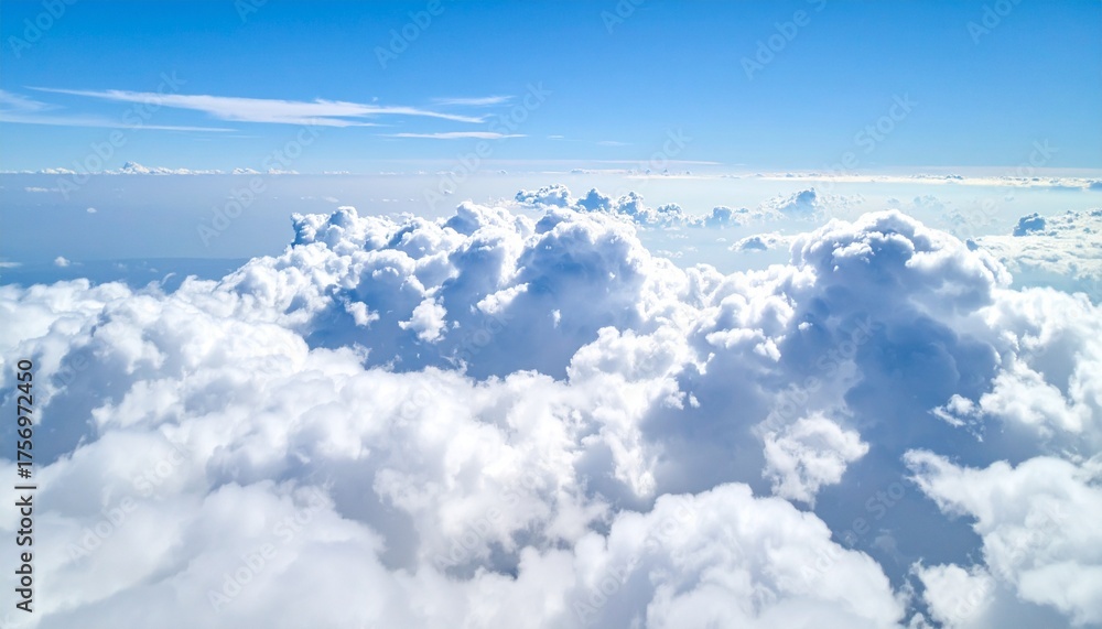 Fototapeta premium Soaring above a vast ocean of fluffy white clouds under a brilliant clear blue sky, inspiring freedom and boundless possibility for travel and dreams.