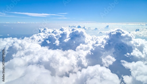 Soaring above a vast ocean of fluffy white clouds under a brilliant clear blue sky, inspiring freedom and boundless possibility for travel and dreams.
