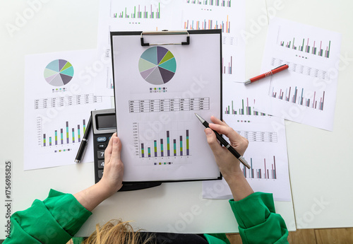 Photography Woman reviewing company financial results, working businesswoman