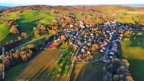 Village in green nature in the hills under the rays of the sun