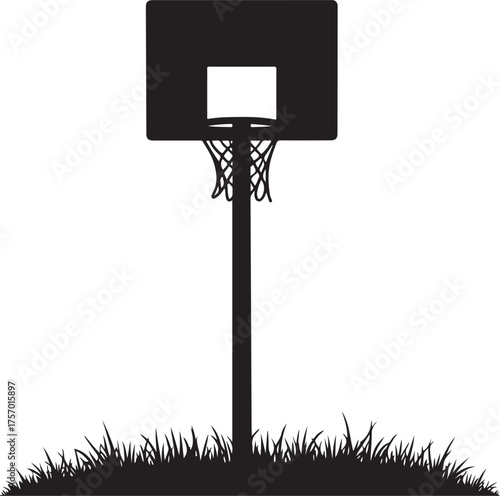 Black silhouette of a basketball hoop and net on a pole over grass