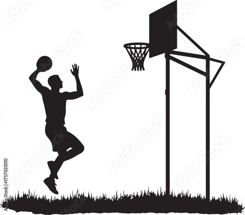 Silhouette of a basketball player dunking on a hoop