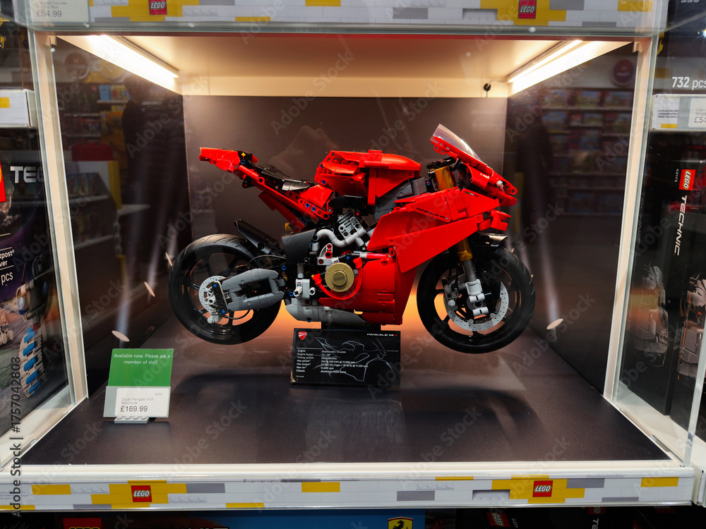 Naklejka premium Red Lego Ducati Panigale V4 S motorcycle on display at store shelf with metallic accents and detailed design
