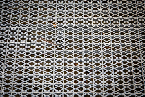 Photography Galvanized metal grating surface for pedestrian walkway ramp or crossing providi