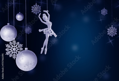 Elegant Christmas composition with silver baubles, delicate snowflakes and a ballerina ornament on a dark blue festive background. 