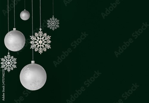 A magical Christmas scene with elegant silver baubles, shiny snowflakes on an emerald green background.