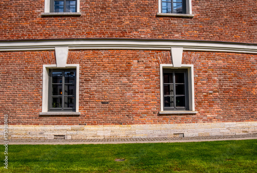 An old brick building with windows.