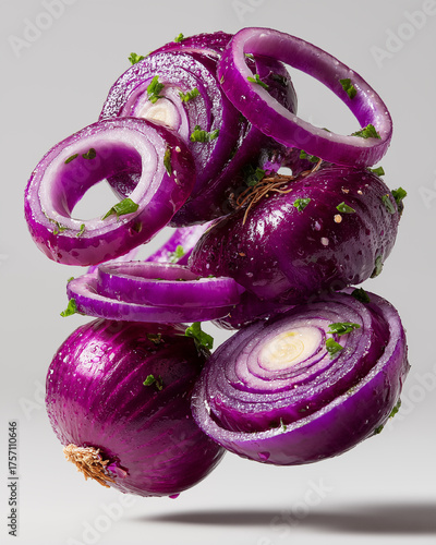 Sliced red onion with parsley and garlic on white background