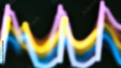 Abstract animation of a colorful glowing waveform. Rhythmic pulse resembling a medical EKG heartbeat or a sound wave. Soft focus technology background