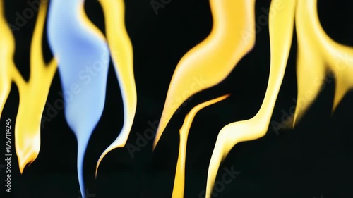 Vertical video of abstract liquid art. Glowing yellow and blue fluid forms a heart shape and drips like molten paint. Dynamic motion background