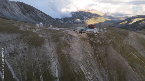 Aerial drone footage of the Astronomical Observatory of Abruzzo at Campo Imperatore, set against majestic mountain landscapes