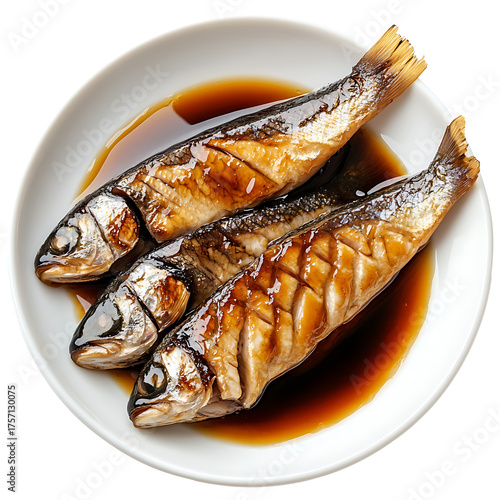 Three cooked fish in soy sauce on white plate isolated on transparent background