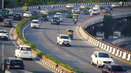 Vehicles moving on busy Delhi road during daytime