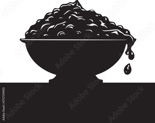 A dark bowl overflowing with textured food a striking black silhouette