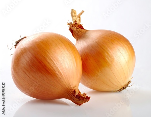 Wallpaper Mural Two golden, whole onions on a reflective white background, close-up Torontodigital.ca