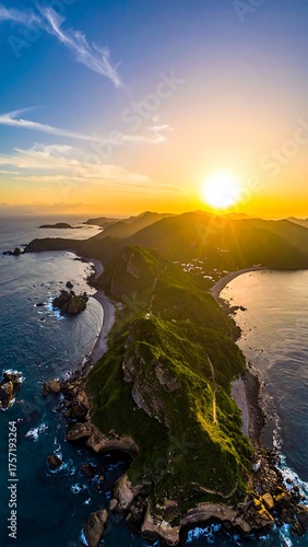 Aerial view captures a sun-kissed coastal peninsula at sunset