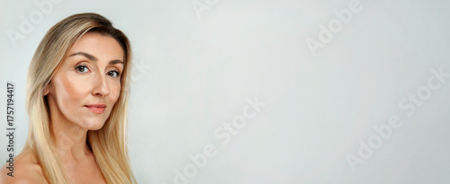 Gorgeous 50s mid middle aged mature woman isolated on white background. Healthy face skin care beauty. Old lady close up smile portrait. Anti age concept for Skincare, Cosmetics Product, web banner