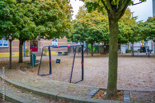 A bright, empty playground with a variety of colorful children's equipment that encourages active play and healthy development. High quality photo