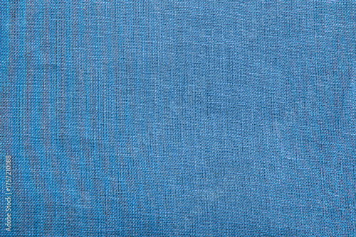 Close up view of denim blue woven fabric. Quality linen textile texture ideal for backgrounds or design