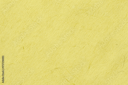 Yellow paper texture with soft fibrous surface and organic imperfections, ideal for backgrounds and print design. Concept of color of year, yellow texture, natural background, organic material