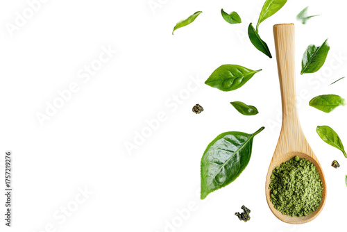Green tea leaves and spoon with tea isolated on transparent background. Natural matcha green tea powder in a wooden spoon beside fresh tea leaves on a white background.
