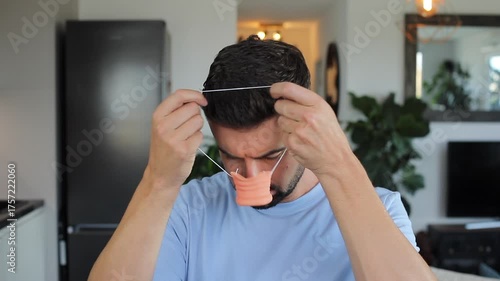 Man playing a fake plastic pig nose during Halloween 