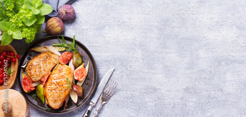 Duck breasts with figs, shallots and sherry gravy. View from above, top studio shot with copy space