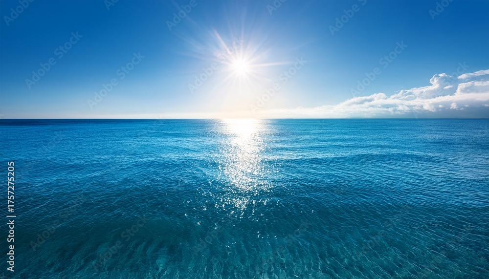 Obraz premium The Ocean Is Calm And Clear With A Bright Sun Shining Through The Water