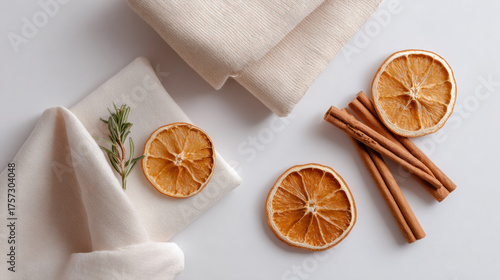 Wallpaper Mural Cozy and natural flat lay of dried orange slices, cinnamon sticks, and rosemary on white background. Perfect for winter home decor, exuding calm and festive aroma Torontodigital.ca