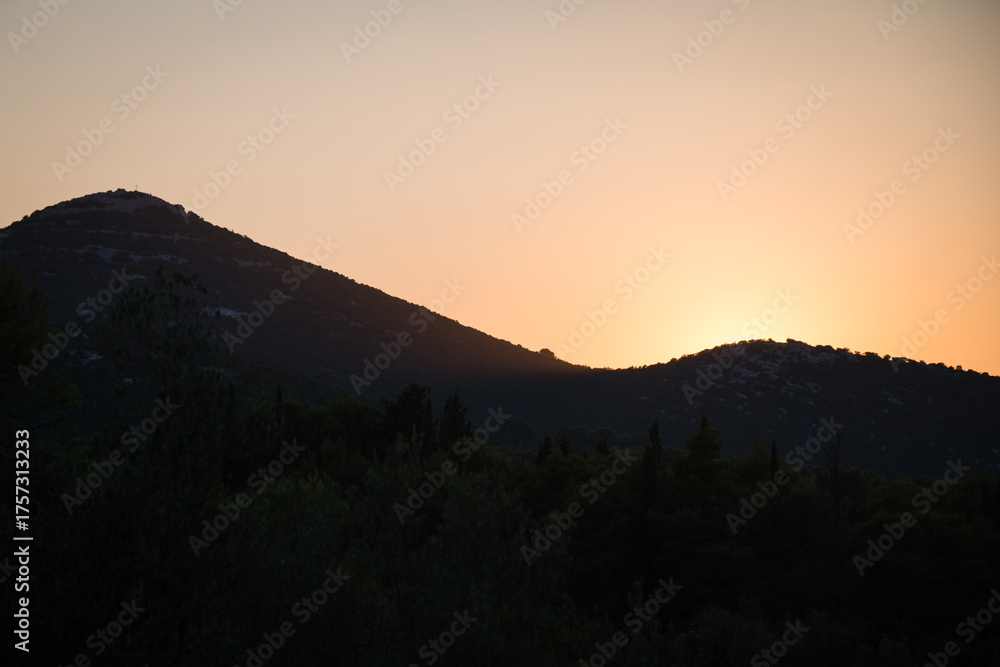 Fototapeta premium Silhouette of Scah hill on the Ugljan island at sunset, Croatia