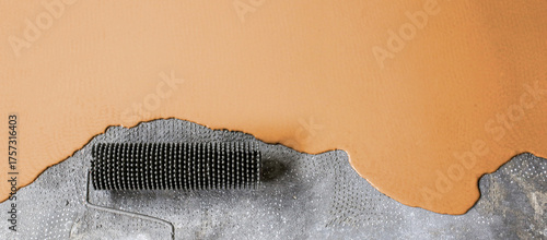 The concrete floor is orange painted. Contractor will paint garage floor to accelerate home sale