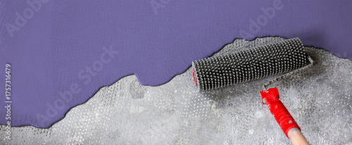 The concrete floor is violet painted. Contractor will paint garage floor to accelerate home sale