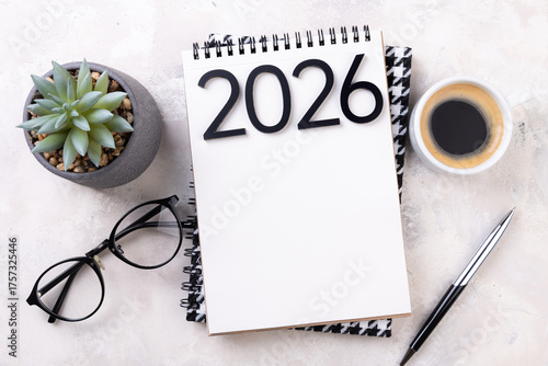 New year goals 2026 on desk. 2026 resolutions list with notebook, plant on table. Resolutions, plan, goals, action, checklist, idea concept. New Year 2026 resolutions, copy space