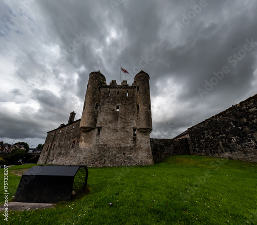 Enniskillen Castle is standing on the banks of Lough Erne in Northern Ireland. Dramatic clouds
