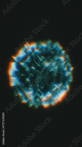 An abstract circular light pattern moves and pulses with blue and orange coloring.