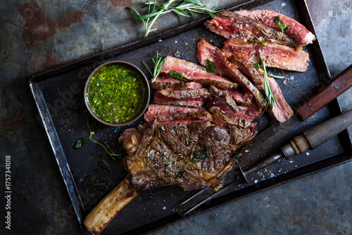 Ribeye beef steak grilled with herb sauce