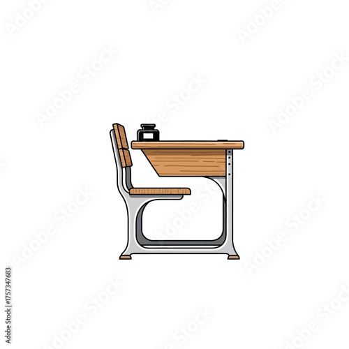Vintage school desk with inkwell for education and learning.