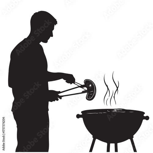 Silhouette of a Man Grilling a Sausage Over a BBQ