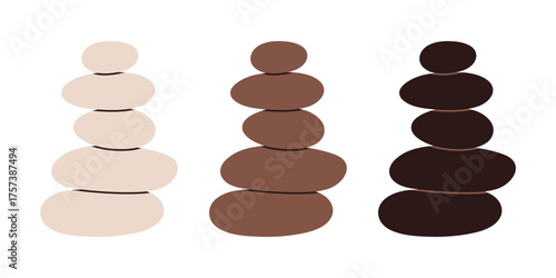 Set of stacked Zen stones cairns in earthy colors. Great for spa, meditation, and wellness design.