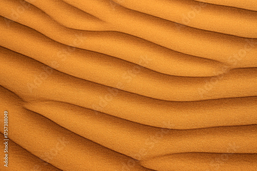 Fototapeta Naklejka Na Ścianę i Meble -  Golden desert sand dunes create rippling waves