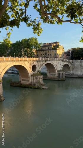 View of the Sisto Bridge spanning the Tiber River in Rome's historic center.