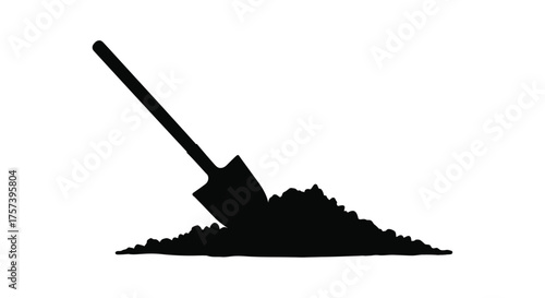 Silhouette of a shovel stuck in a pile of dirt representing digging gardening or construction work silhouette