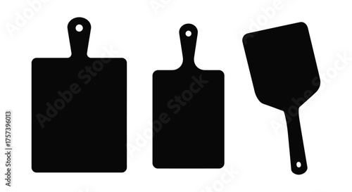 Set of three black cutting boards and pizza peel silhouettes isolated on for culinary use silhouette